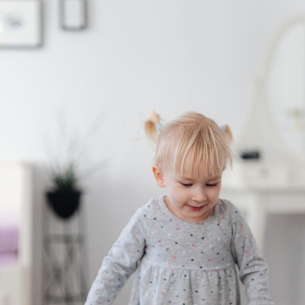 Toddler girl walking – Stage 4 formula, 12+ months