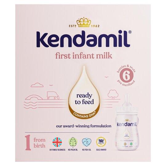 Kendamil first infant milk packaging on a light pink background
